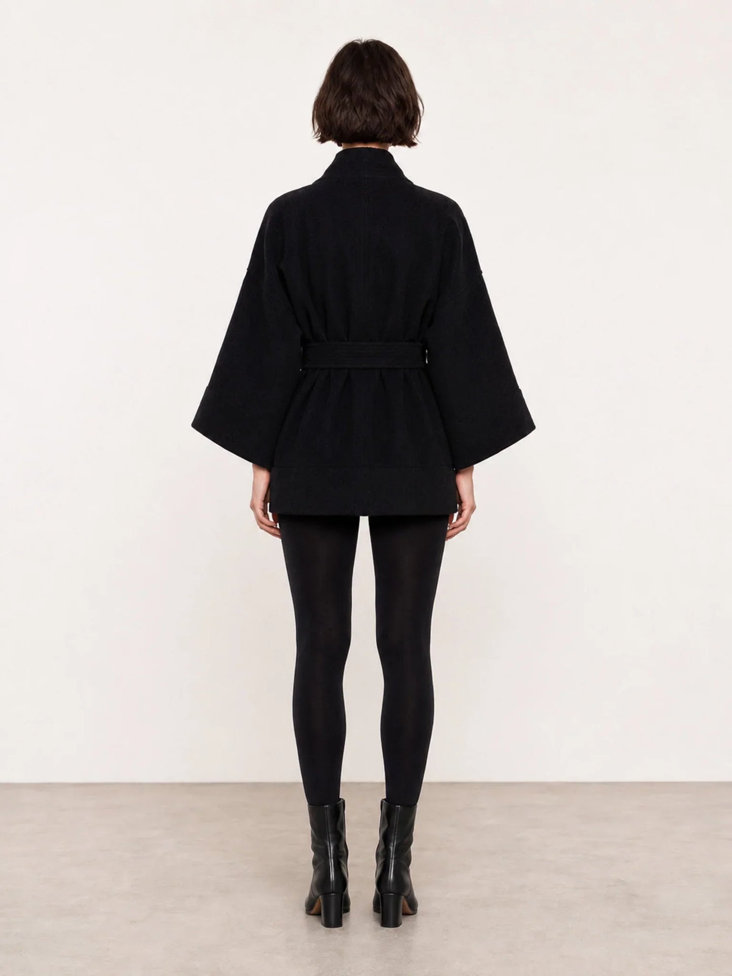 A back shot of a model wearing a pure Wool kimono jacket made by Atelier Mizuni