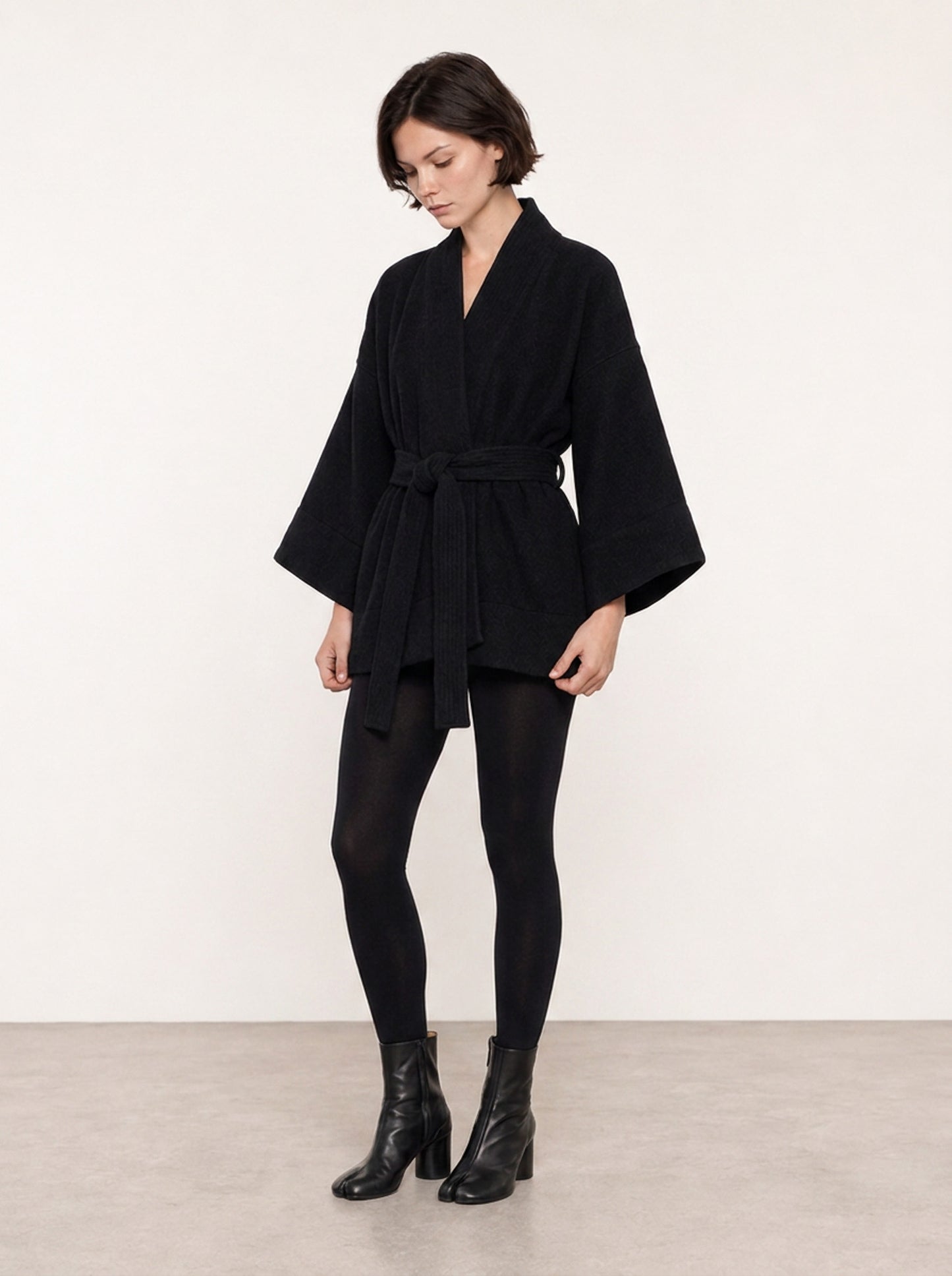 A front shot of a model wearing a pure Wool kimono jacket made by Atelier Mizuni
