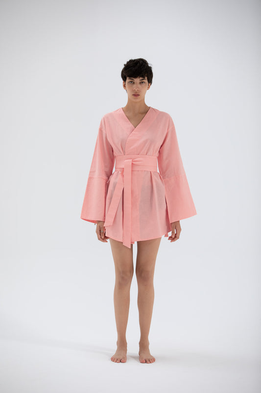 model wearing a pink short kimono dress designed by atelier mizuni