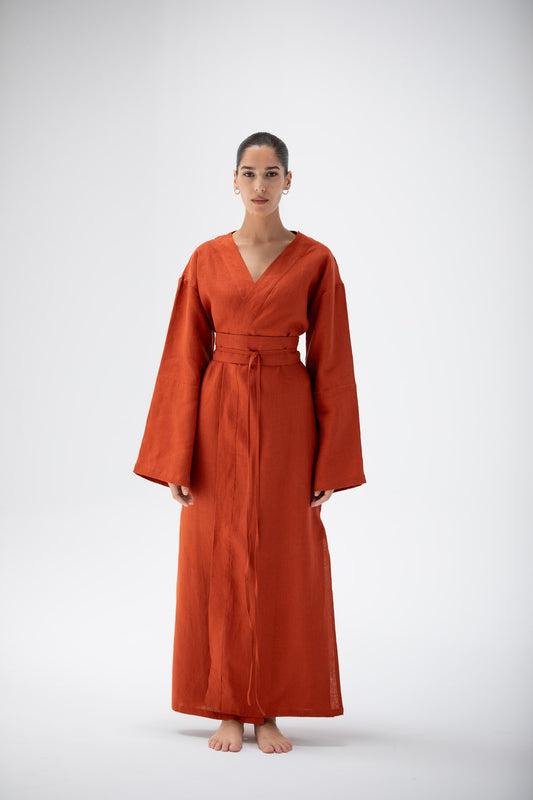 Woman wearing a terracotta kimono dress made of pure linen 