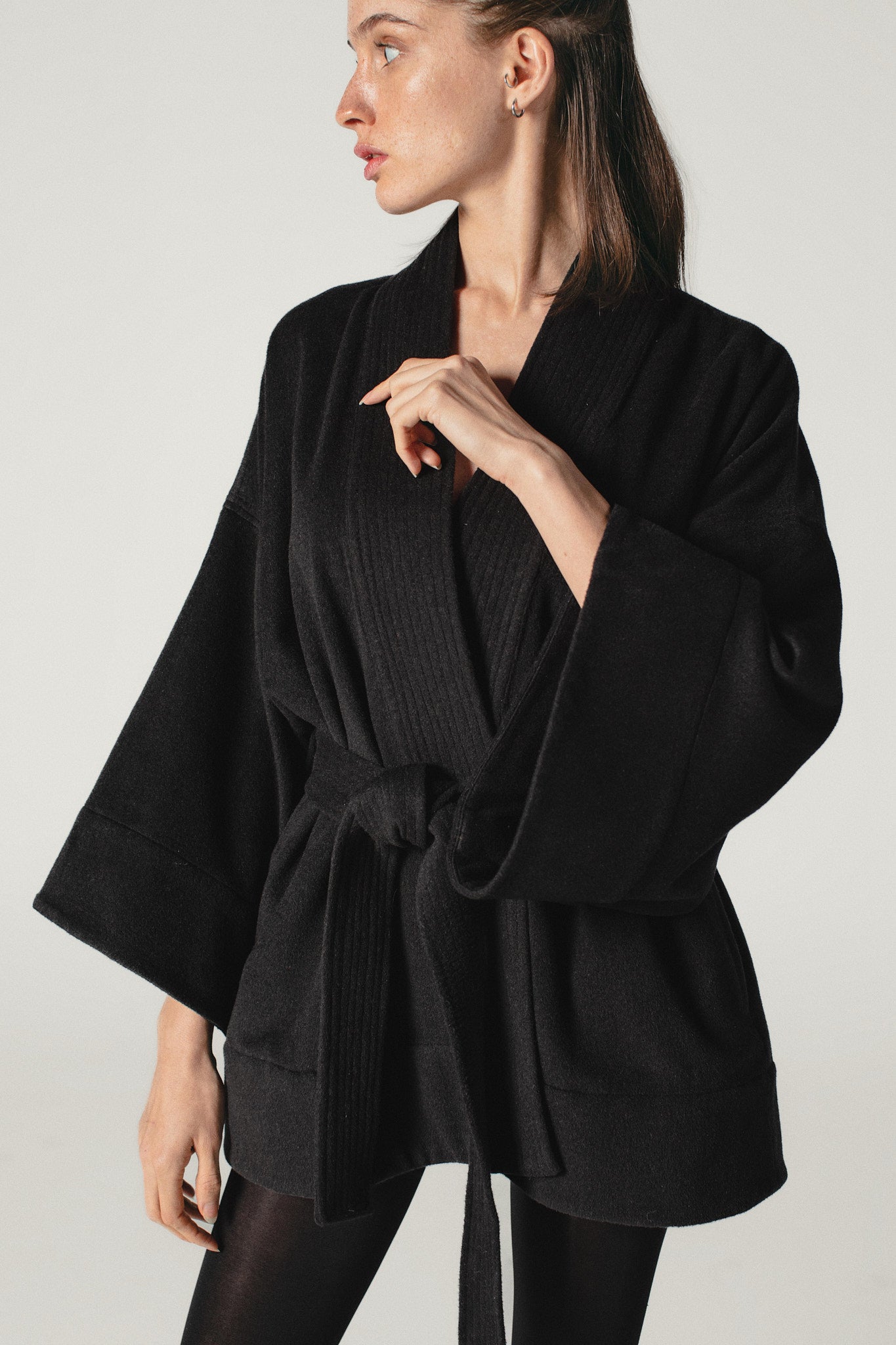 A side shot of a model wearing a Wool  & Cashmere kimono jacket made by Atelier Mizuni