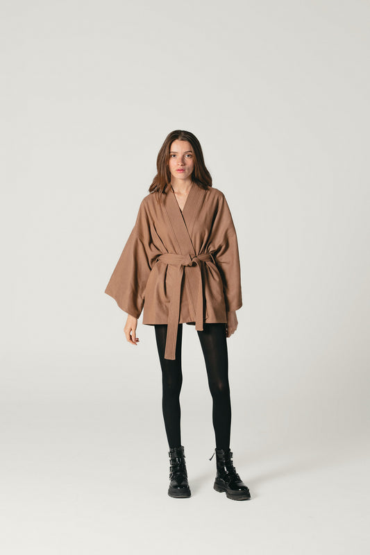 A front shot of a model wearing a camel Pure Wool  kimono jacket made by Atelier Mizuni