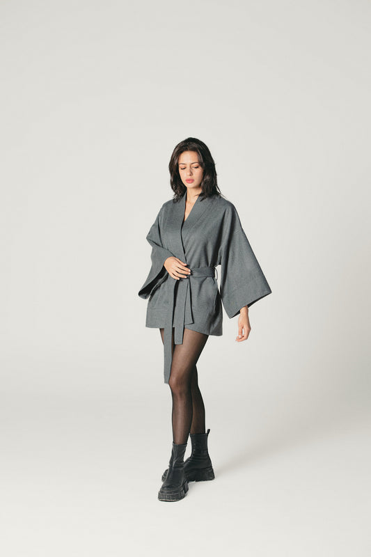 A shot of a model wearing a pure wool kimono jacket in Grey color made by atelier mizuni