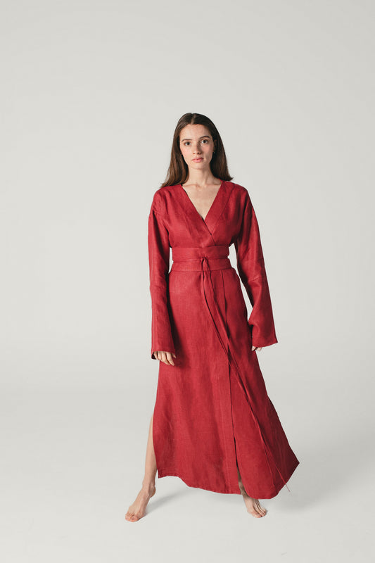 A  model wearing a Red Wine linen kimono dress made by atelier mizuni